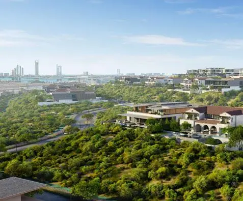 Aerial view showing elevated villa community and surrounding green corridors