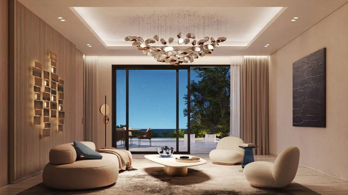 Elegant dining area featuring marble flooring, ambient lighting, and sleek furniture in a Nawayef East mansion.