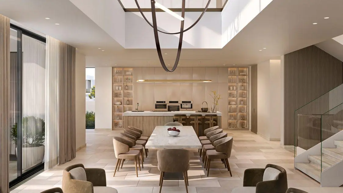 "Cozy reading nook with panoramic views, soft textiles, and warm tones in a Nawayef East interior.